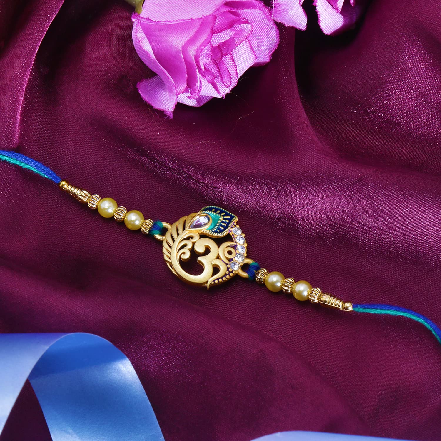 Riddhika Ventures Religious Meenakari Om and Peacock Feather Rakhi With Roli Chawal And Greeting Card